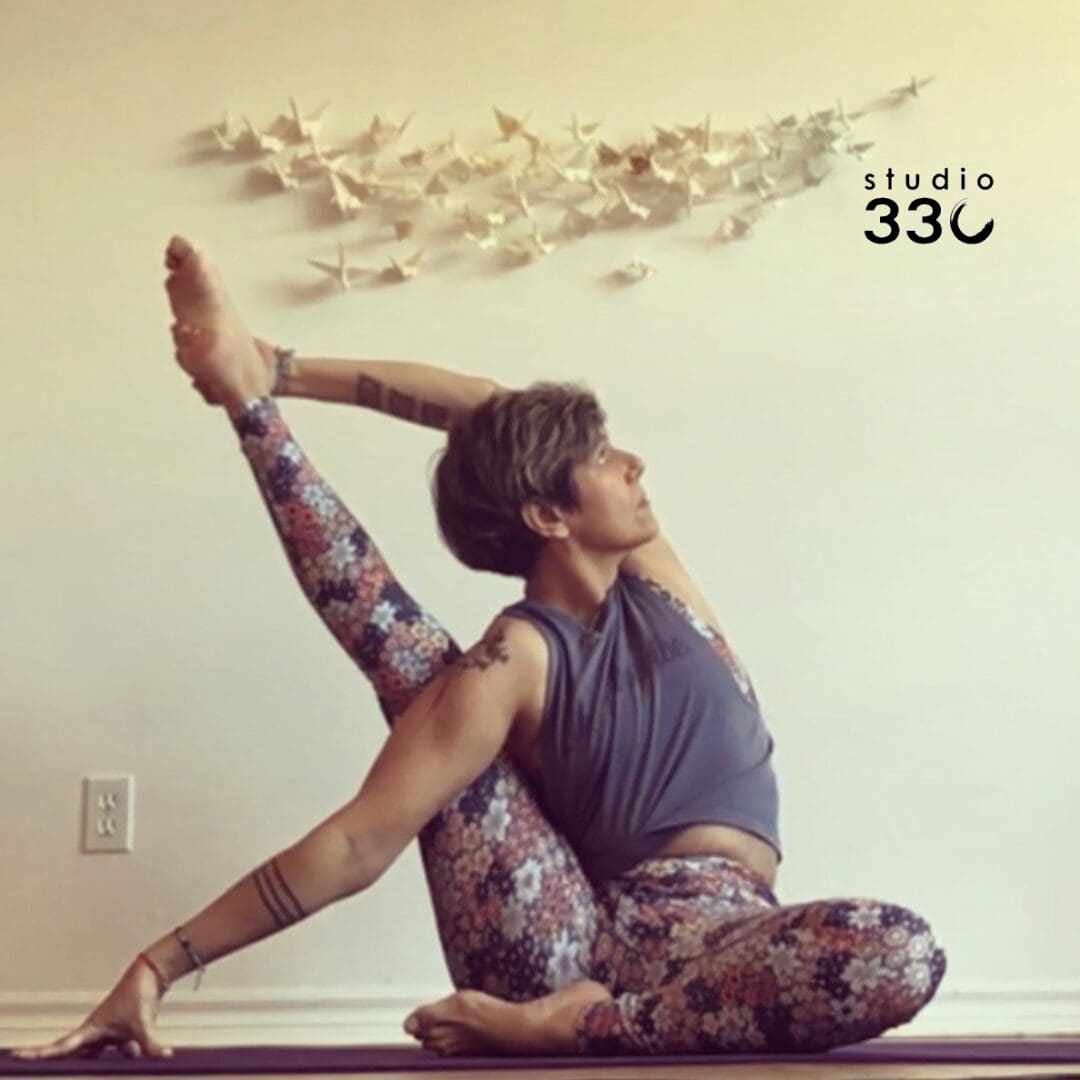Frederique doing Parivrtta Surya Yantrasana (Sundial Pose)